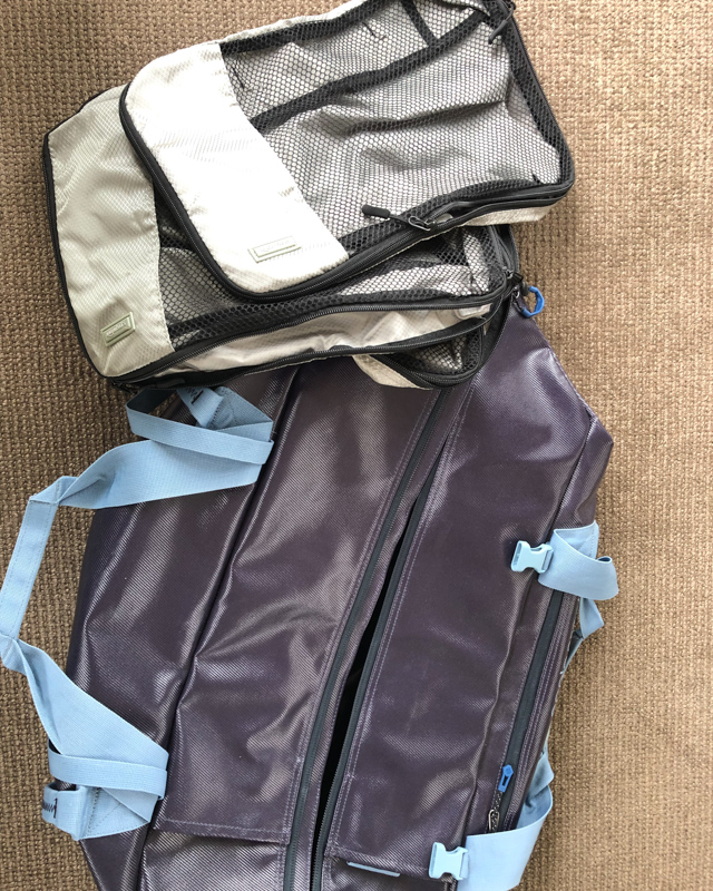 Eagle creek migrate duffel bag and Amazon brand packing cubes.