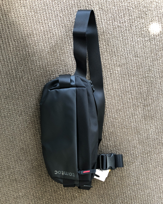 Tomtoc EDC 4L travel sling displayed.